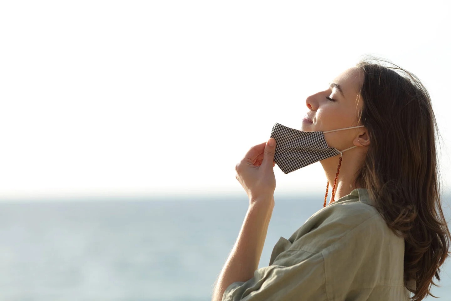 women breathing air removing mask