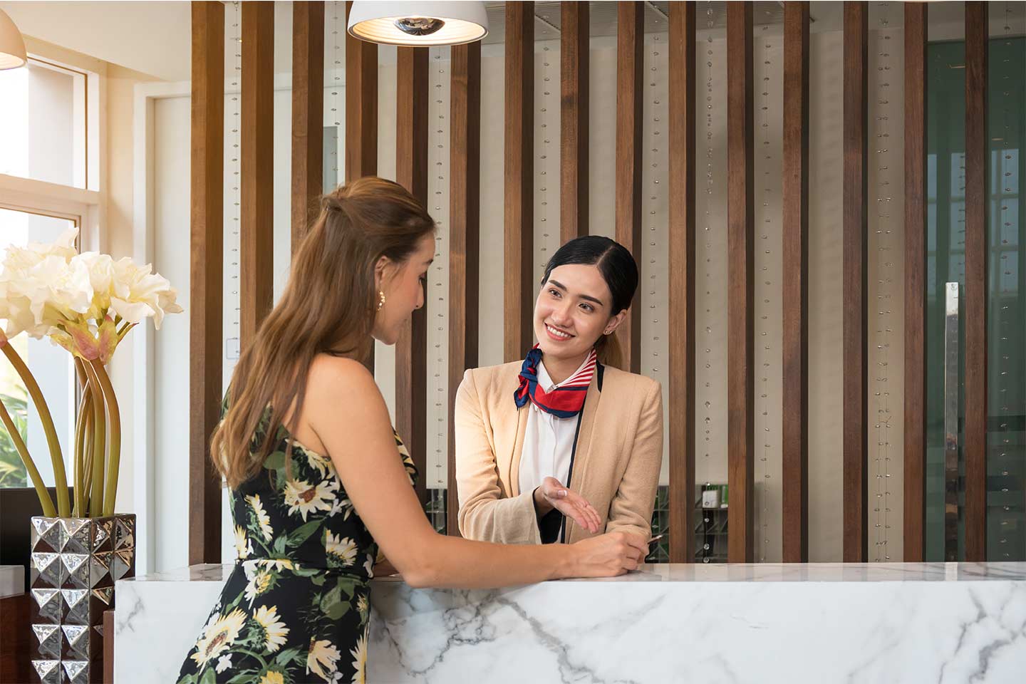 interaction between a hotel receptionist and hotel guest