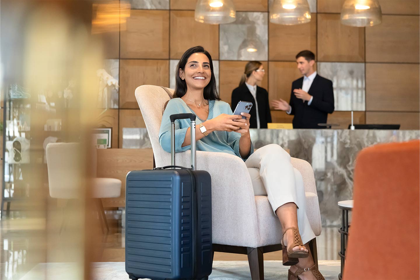 guest seated in hotel lobby